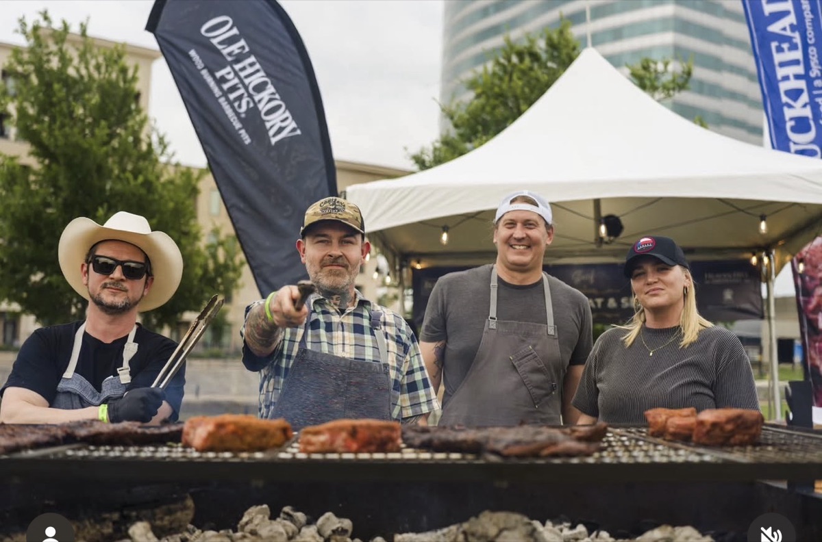 Adrian Verdin working the pit at a Dallas barbecue event
