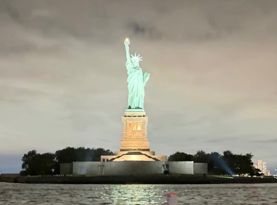The Statue of Liberty at night, photographed from the water
