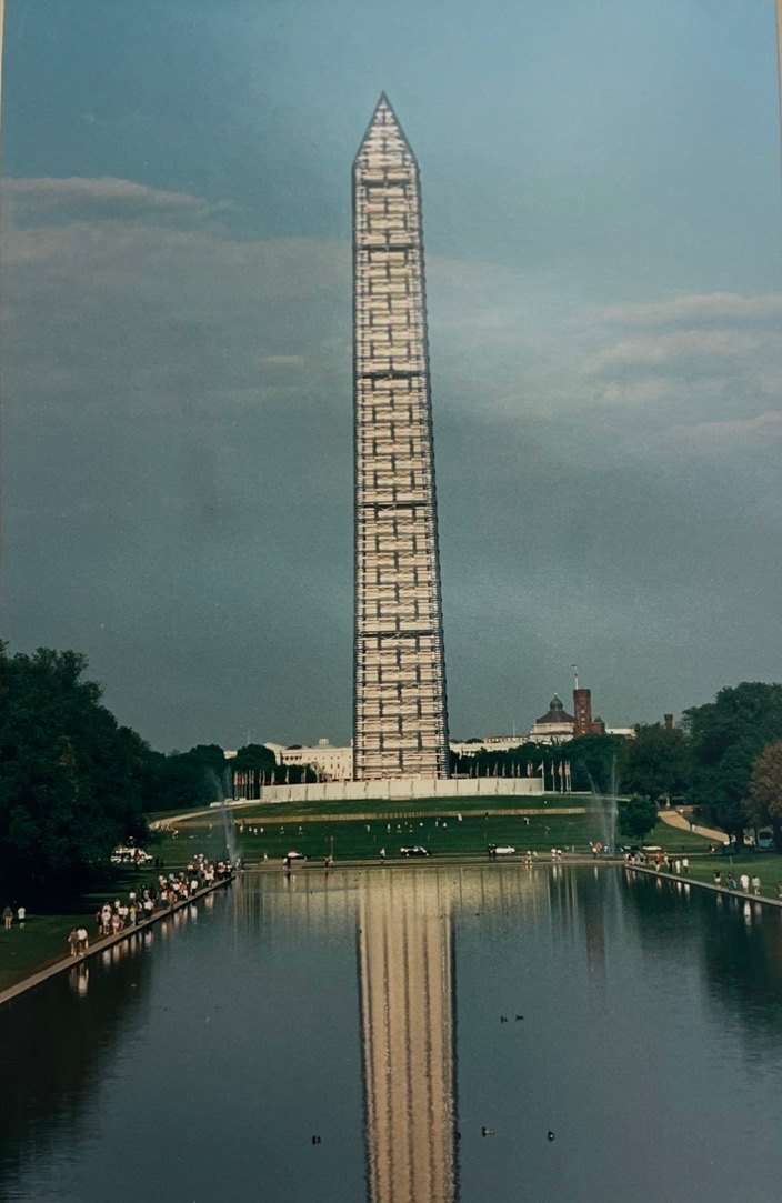 The Washington Monument wrapped in UBS scaffolding, seen across the reflecting pool, 2000