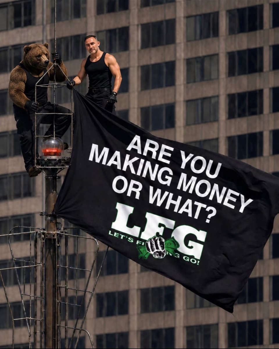 David Stodolak and the LFG bear planting a flag reading Are You Making Money Or What? high above the city