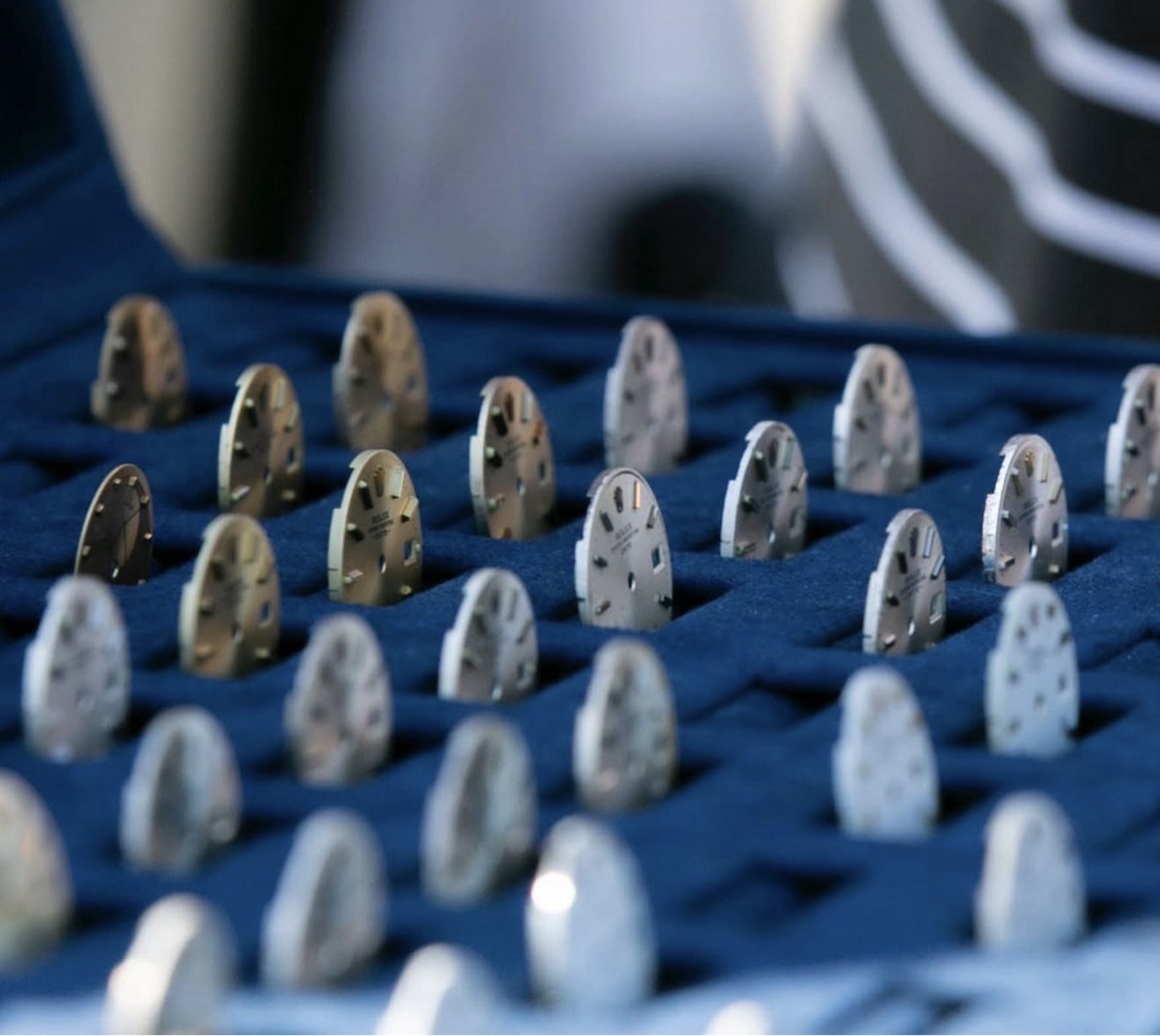 A presentation case of genuine Swiss watch dial ball markers by Luxury Ball Marks