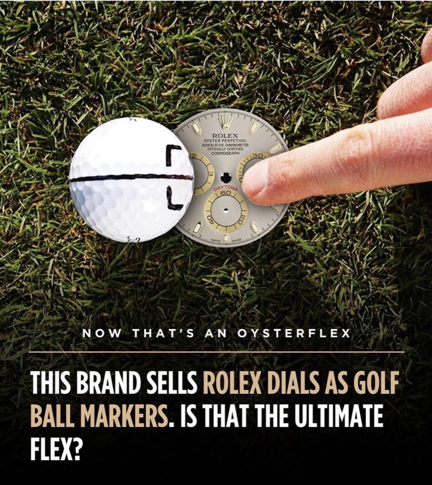 A genuine Rolex Daytona dial used as a golf ball marker on the green — Luxury Ball Marks