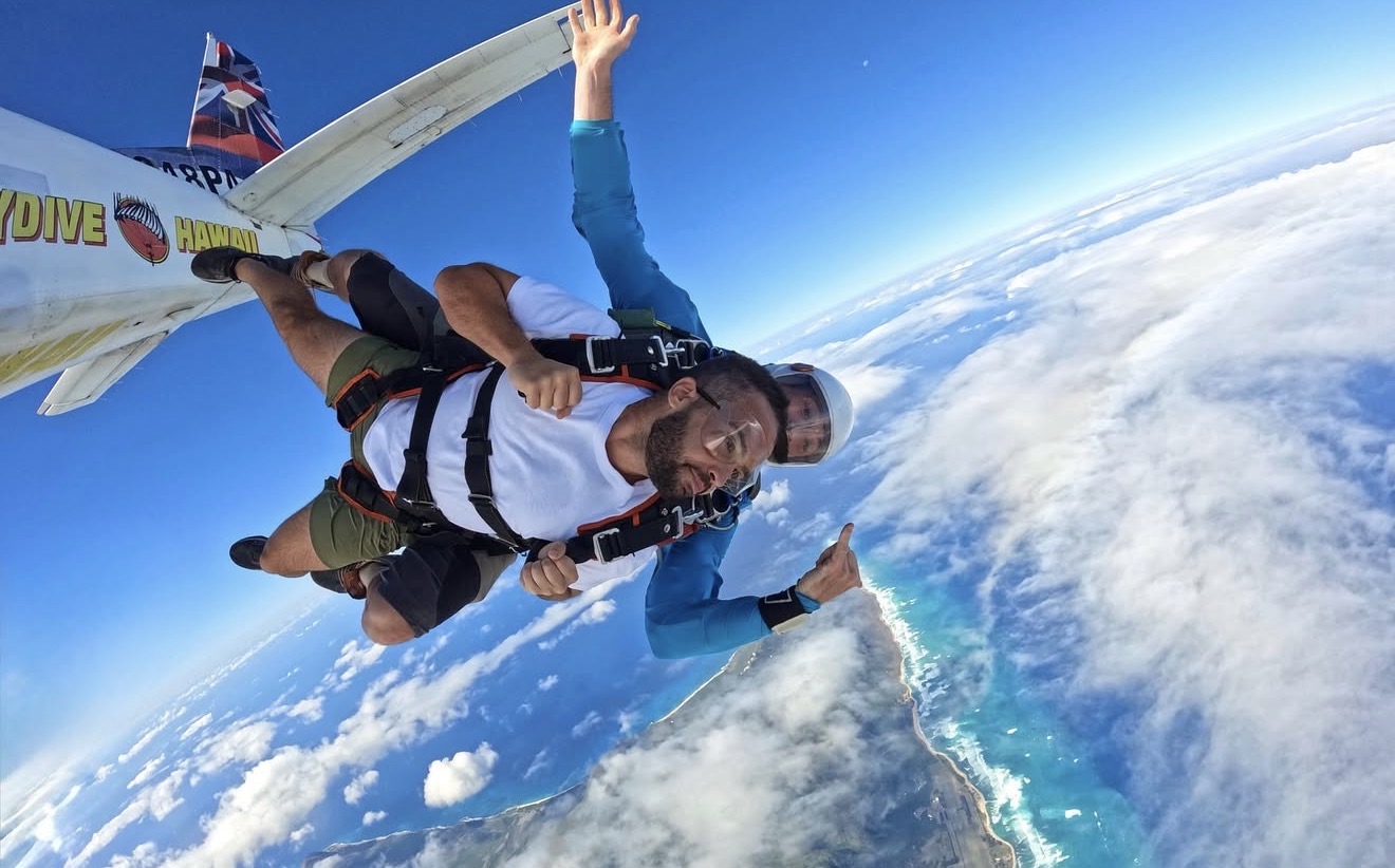 Zack West skydiving over the Hawaiian coastline