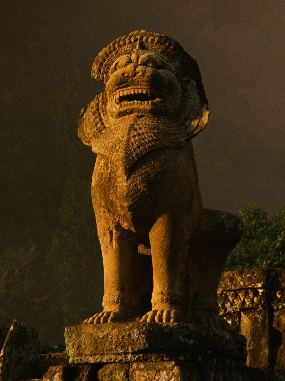 A stone guardian lion standing unbroken at the temple steps