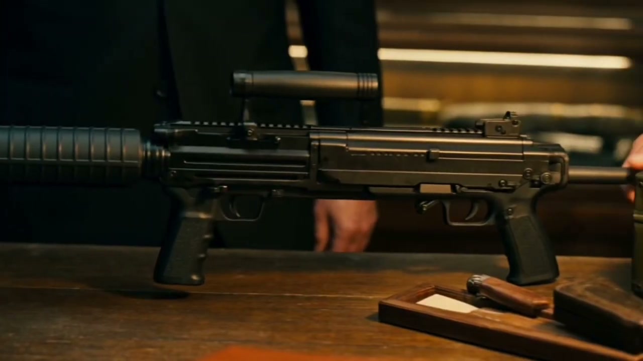 A weapon laid out on the polished bench under the lamp