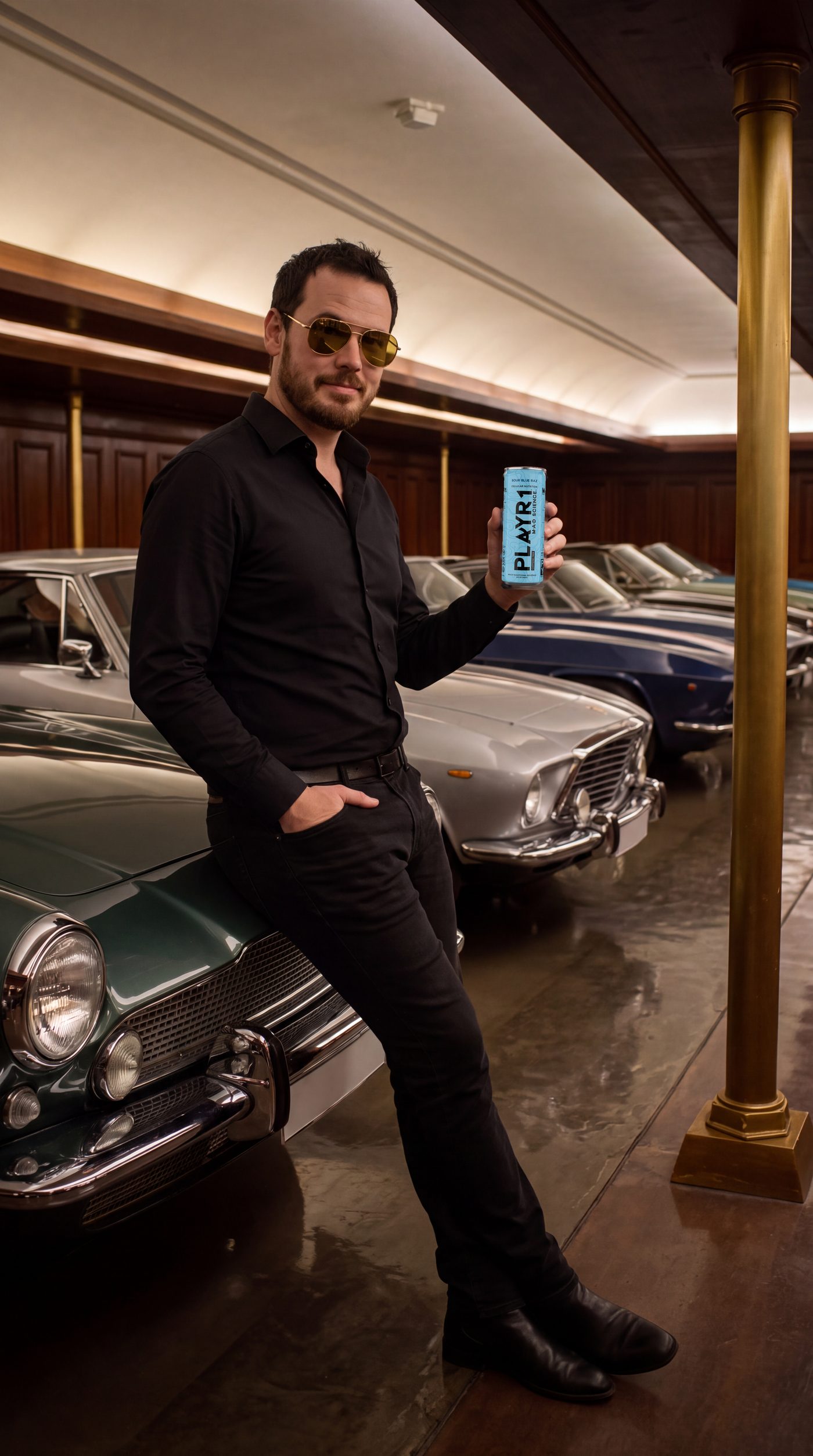 Member Barrett Edri in a black shirt and gold aviators, leaning on a green classic car in the c1ub's Garage and holding a Sour Blue Raz PLAYR1 can