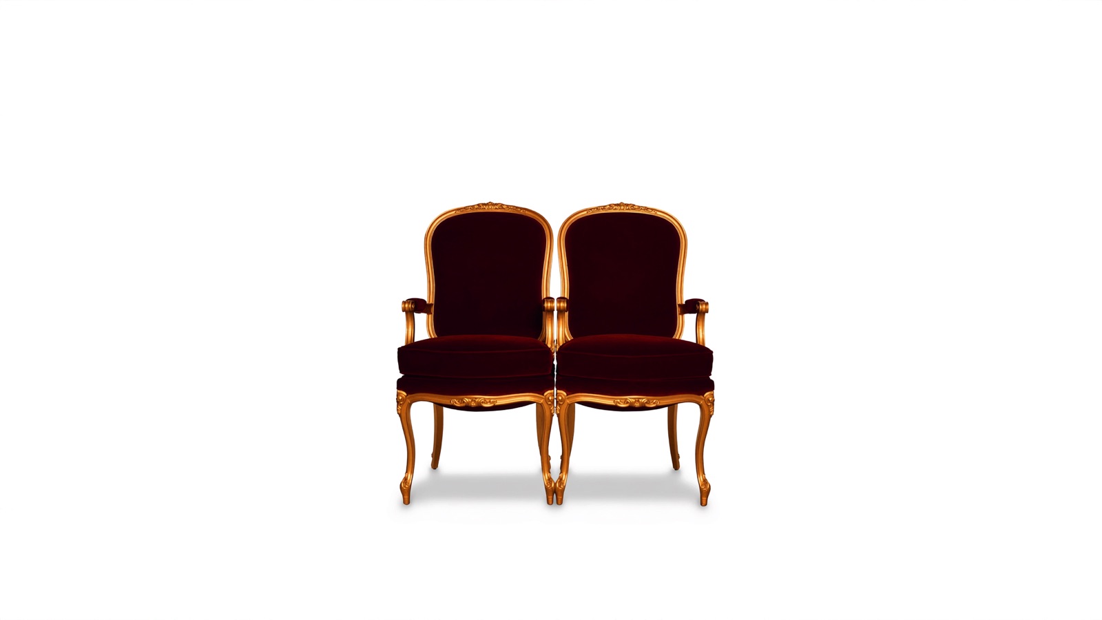 Two burgundy velvet cinema seats alone in the infinite white studio, lit by a single warm beam