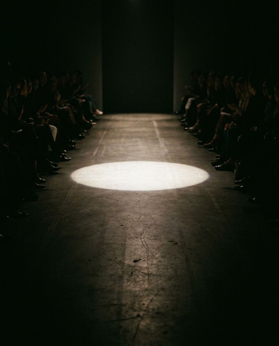 One empty circle of spotlight waiting on a dark runway